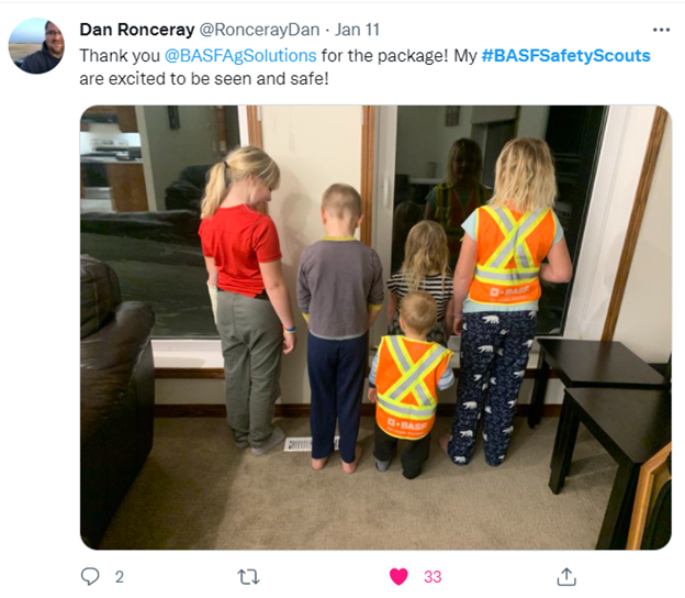 Tweet featuring kids in orange vest