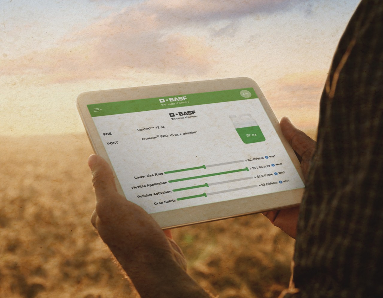 Farmer standing in a field holding an iPad