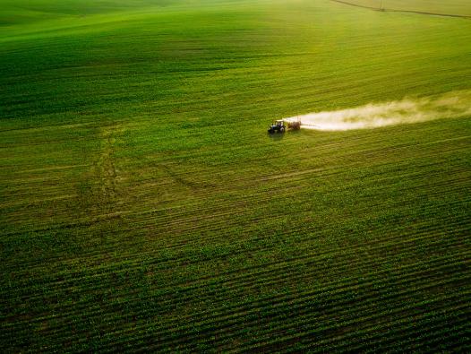 Tractor in soy field