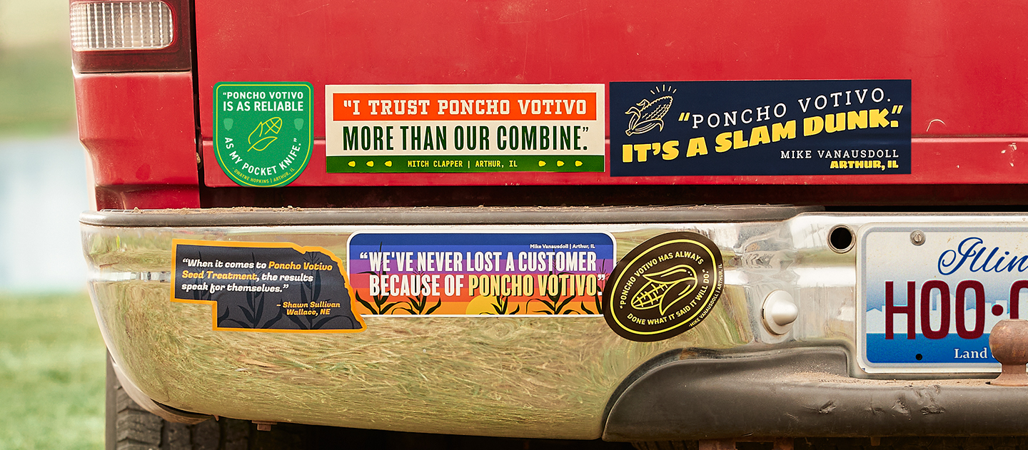 Many Poncho Votivo bumper stickers on a car's bumper.
