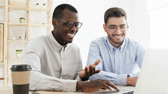 Two men looking at a labtop