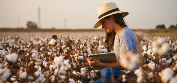 Woman standing in cotton field